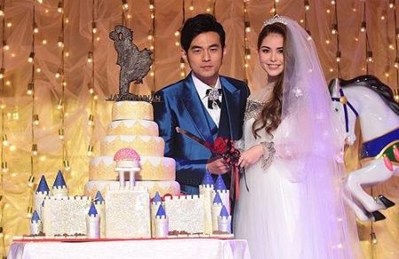 Hannah Quinlivan in a wedding gown with her husband Jay Chou at their wedding ceremony.